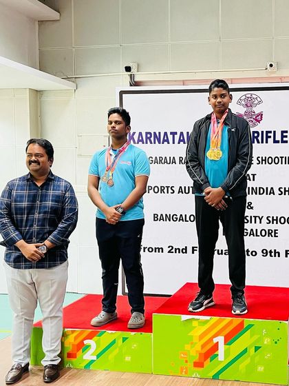 Darren on the podium after winning in the Air Pistol Men's category.