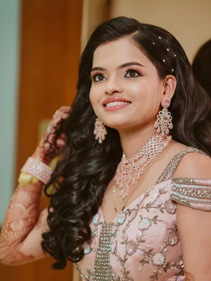 A candid shot of this lovely client. Her makeup is fresh and radiant, with a focus on glowing skin and beautifully defined eyes.