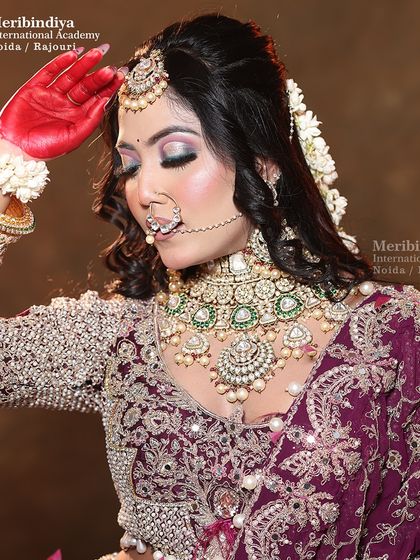 This pose showcases the intricate jewelry and how the makeup complements it without being overpowering. Balance is a key principle I teach.