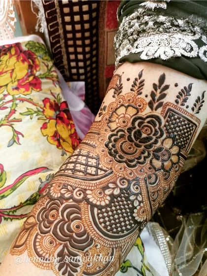 Another angle of the floral and paisley arm design, highlighting the beautiful checkerboard filling.