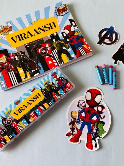 We love creating personalised stationery sets for kids. This one includes a custom notebook and pencil box in a cool superhero theme.