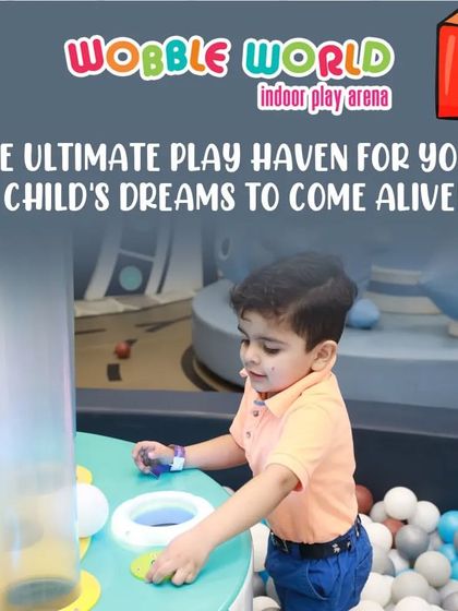 A child fully engaged with an interactive game. Our play haven is where your child's dreams of fun and adventure come alive.