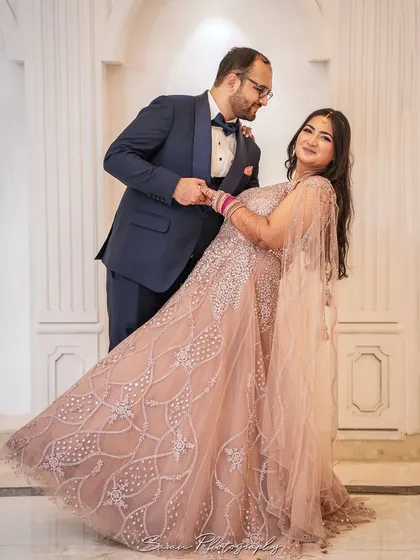 A playful and romantic shot of the groom dipping the bride during their engagement photoshoot.