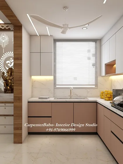 This kitchen is designed next to a beautiful puja unit, showing how different functional areas can be harmoniously blended. The kitchen itself is modern and efficient.