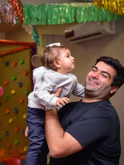 Cuddles of joy! A father and his little one sharing a beautiful, happy moment.