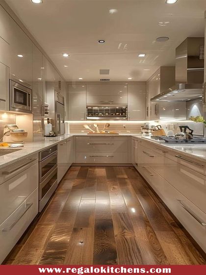 This U-shaped kitchen combines high-gloss cabinets with a warm wooden floor, creating a sophisticated and welcoming space. The layout is designed for an efficient workflow, with integrated appliances and ample lighting.