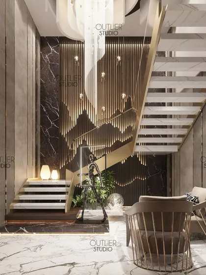 In this triplex entrance lobby, I designed a feature wall with backlit, mountain-shaped metal fins. This artistic element conceals the staircase while creating a dramatic and unique first impression.