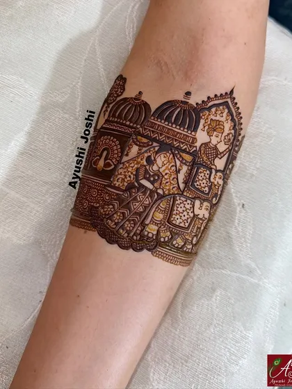 A close-up of the armband showing the groom's grand entry on a royal elephant.