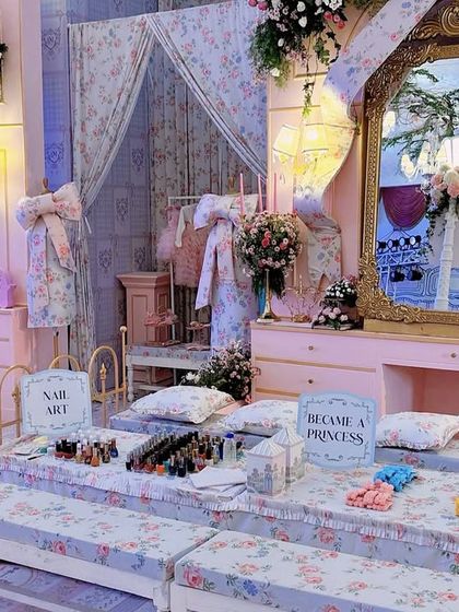 A 'Become a Princess' pamper station, complete with floral-upholstered benches, ornate gold mirrors, and a nail art bar for the little guests.