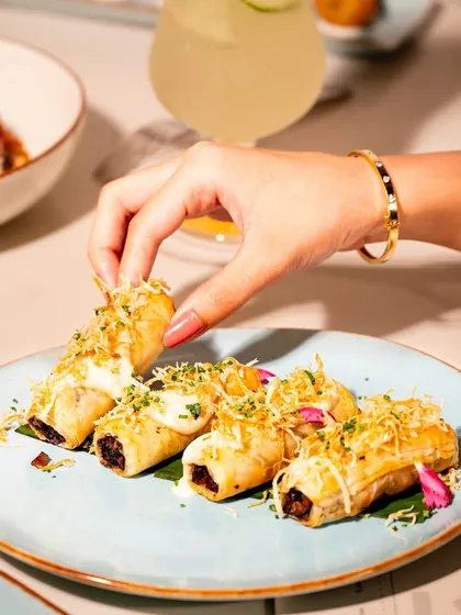 A savory twist on a classic pastry. Our Truffle Mushroom Éclair features an earthy mushroom filling, finished with a delicate parmesan frosting and crispy leeks. This bite-sized creation is a perfect example of how we reimagine familiar concepts for a luxury catering experience.