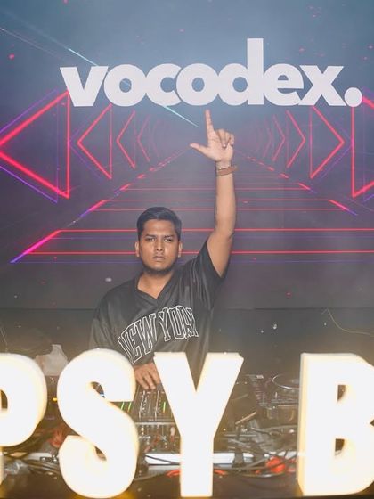 Going B2B with Almost Human. This shot captures the energy of two DJs working together, pointing to the crowd and sharing the moment.