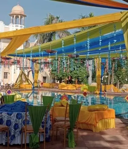 Another look at a poolside Haldi event, showcasing how we use colorful drapes and seating arrangements to create a festive atmosphere. We manage everything for destination wedding functions in places like Lonavala and beyond.