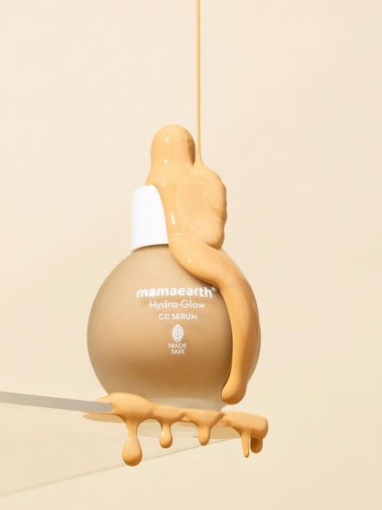 This levitation shot uses a clear acrylic shelf to create the illusion of a floating product. The thick, glossy texture dripping over the bottle and shelf adds a dynamic and tactile element.