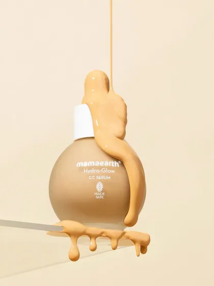 This levitation shot uses a clear acrylic shelf to create the illusion of a floating product. The thick, glossy texture dripping over the bottle and shelf adds a dynamic and tactile element.