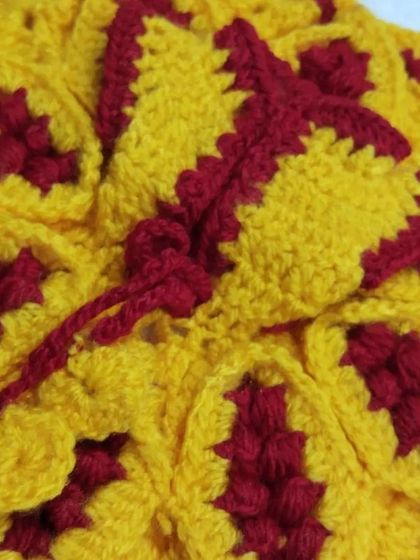 A beautiful crochet woolen dress in a festive combination of yellow and maroon. This design is part of my Diwali collection, made to keep Bal Gopal warm during the cooler festival nights.