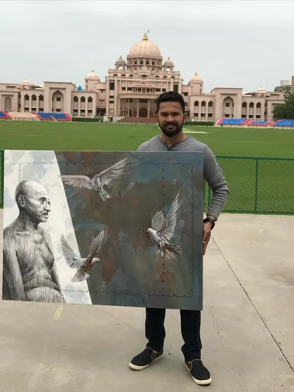 Holding my painting of Mahatma Gandhi, created during a National Artist Camp in Ahmedabad in 2018.