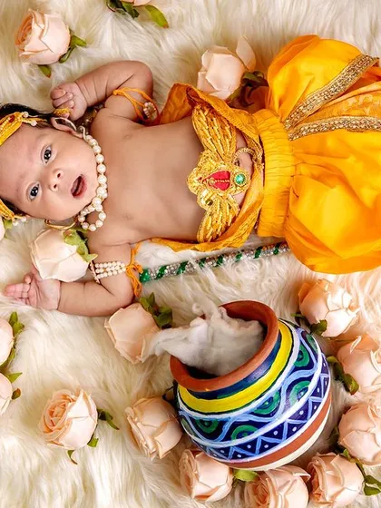 Another beautiful overhead composition of a baby Krishna, surrounded by flowers and holding his flute. We play with different angles and setups to give you a variety of stunning images.