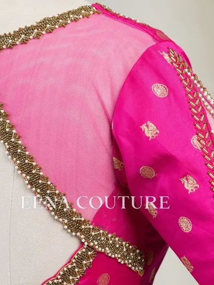 A closer look at the craftsmanship of this pink pure silk blouse. It features intricate handwork with bead detailing on the neckline and delicate net sleeves with linear embroidery for a touch of grace.
