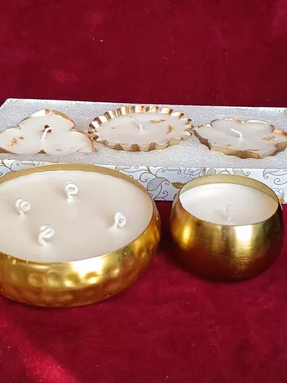 A collection of my golden urli candles, showing different shapes and sizes available for gifting.