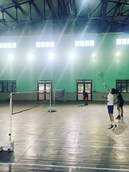 In addition to synthetic surfaces, we offer classic wooden badminton courts. This court provides a traditional playing experience under bright, even lighting.