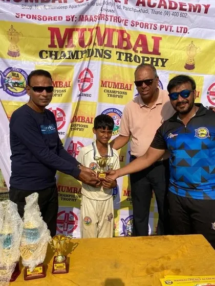 Presenting the 'Best Player of the Tournament' award to Parth Rane at the Mumbai Champions Trophy.