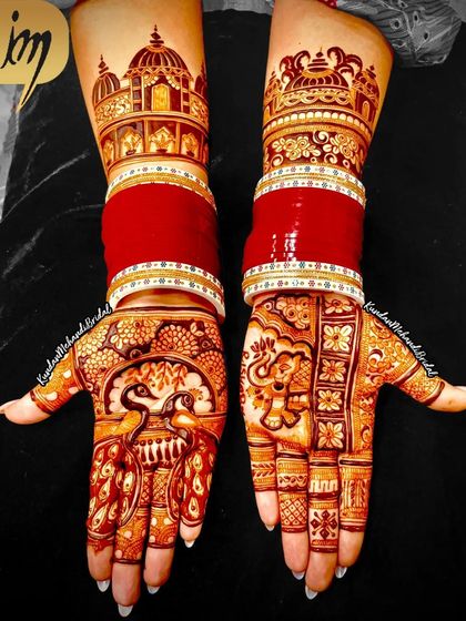 This design combines traditional peacock motifs with the bride's red wedding bangles (chooda), creating a stunning and complete bridal look.