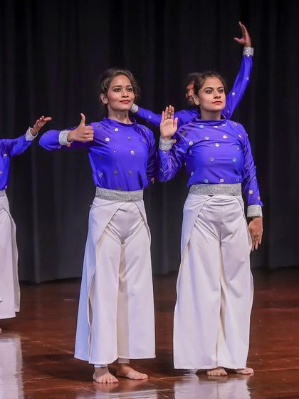 Dancers captured in a moment of expressive movement. Every gesture is choreographed to align with the story and music, ensuring a performance that is both technically proficient and emotionally resonant.