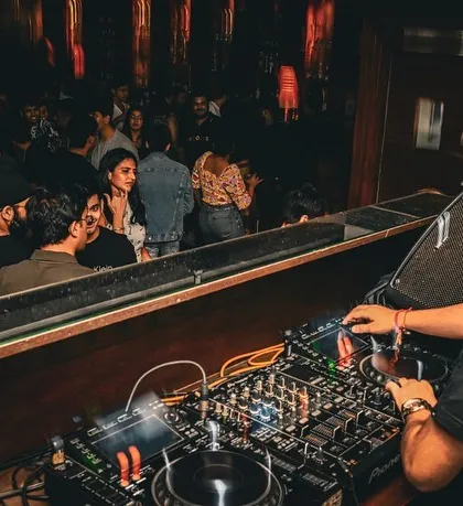 Make it simple, but significant. A view from above, showing me working the controls with the crowd in the background.