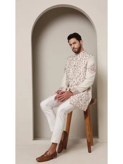 A seated portrait in the Ivory Rose bandhgala. The soft, romantic look is perfect for a special occasion where timeless elegance is key.