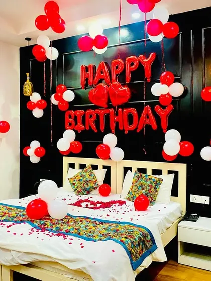 Another angle of this popular red and white birthday room decor. I ensure the balloons are placed thoughtfully to fill the space without it feeling cluttered.