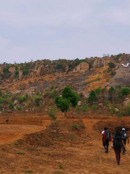 The approach to the crag as the sun sets. The adventure often starts with a beautiful hike through the fields and hills of Ramanagara.