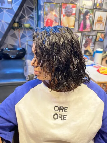 The final result of my permanent hair curling service. These are freshly set, wet curls that will dry into a beautiful, lasting curly hairstyle, perfect for anyone wanting a change from straight hair.