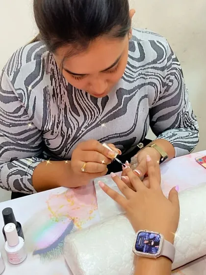 This student is practicing a French manicure, a classic and timeless design that requires precision.
