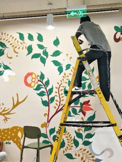Our team meticulously brings a custom mural to life for Databricks. This piece, inspired by traditional Indian art forms, was designed to energize the workspace and connect the team with a shared cultural heritage.