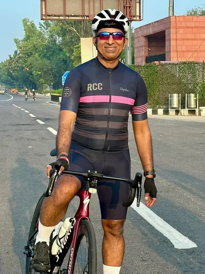A portrait of the birthday boy on his bike, looking fit and happy.