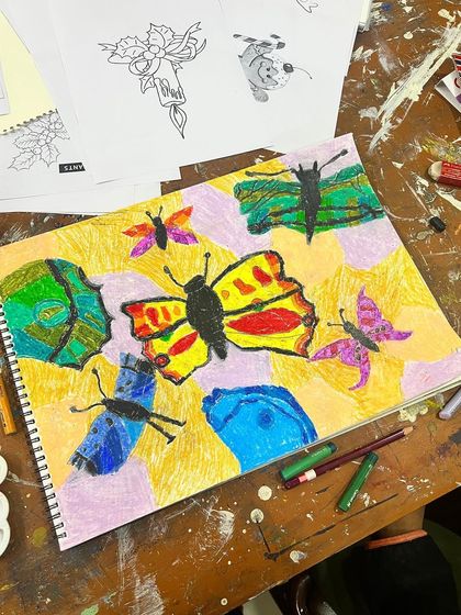 Another take on butterflies, this time with a more illustrative style using oil pastels, from our kids' art classes.