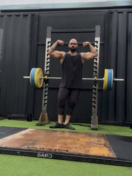 A double biceps pose. This is the result of consistent training and discipline. The iron never lies.