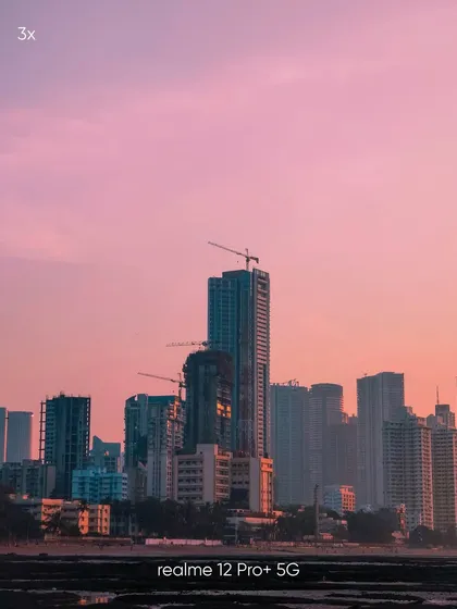 A zoomed-in shot of Mumbai's skyscrapers during a colorful sunset. This image, taken with a mobile phone, shows my ability to find and frame compelling architectural details within a larger cityscape.