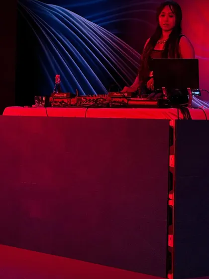 A wider angle of the DJ setup at an exclusive event. I use my laptop alongside the Pioneer decks to manage my extensive music library for any request.