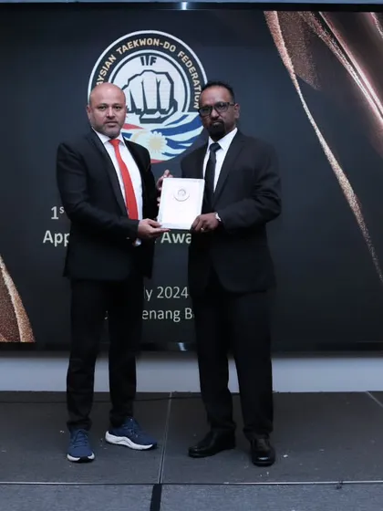 Receiving an award is a humbling experience that reinforces my commitment. This moment from the award night in Penang, Malaysia, represents the global community and mutual respect within martial arts.