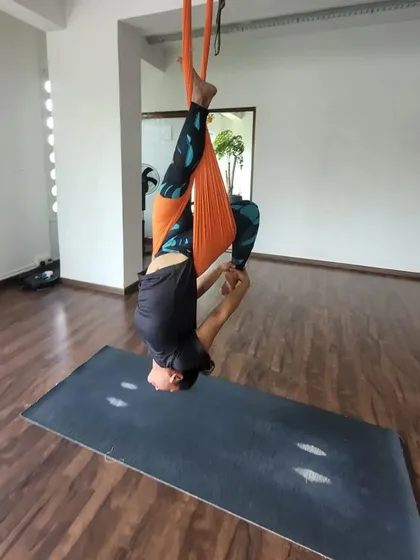 Finding balance and strength in an inverted pose. Our studio provides a safe and encouraging space to explore what your body is capable of.