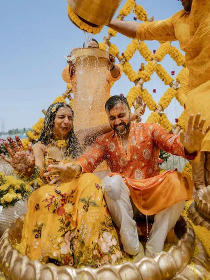 The pure, unadulterated joy of a Haldi ceremony. We love capturing the energy when families come together for this vibrant ritual, like this unforgettable moment from Sparsha and Karthik's lakeside celebration.