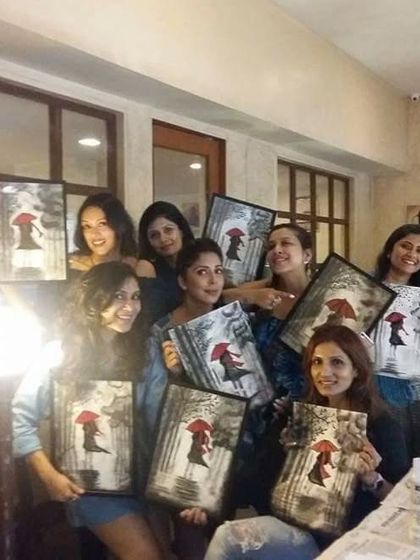 The whole group from our Women's Day paint party, proudly showing off their creations. It was a day of fun, art, and celebrating each other.