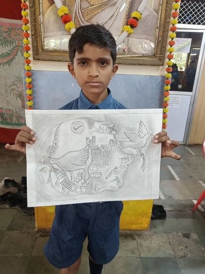 I believe art is for everyone. Here, a student from an underprivileged school proudly displays his detailed pencil sketch, created during a free workshop I conducted to give back to the community.