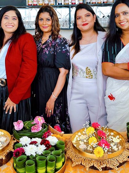 Standing proudly with some of the beautiful floral creations from our workshop with Momsharesclub. Each piece reflects the unique creativity of the participants.