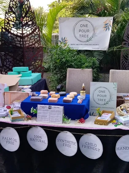 My stall setup at the Vivanta Navi Mumbai Christmas Flea Market, surrounded by festive greenery.