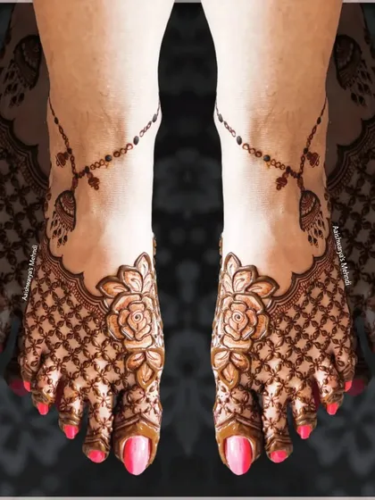 An elegant and modern foot design featuring a rose on the top of the foot with a delicate net pattern. The design is completed with a beautiful beaded chain or 'payal' effect.