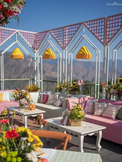 A vibrant 'Picnic in the Mountains' mehendi in Mussoorie, combining playful checkered patterns and bright summer colors against a stunning Himalayan backdrop.