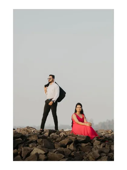 A stylish pose on the rocky shores. I guide couples into poses that feel both natural and cinematic.