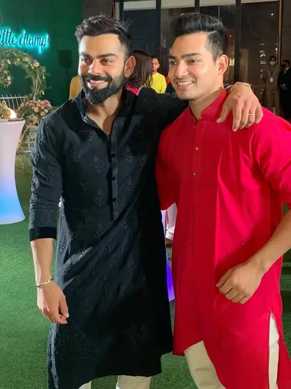 Two generations of our academy's talent, Virat Kohli and Anuj Rawat, together. It is a proud sight for us.